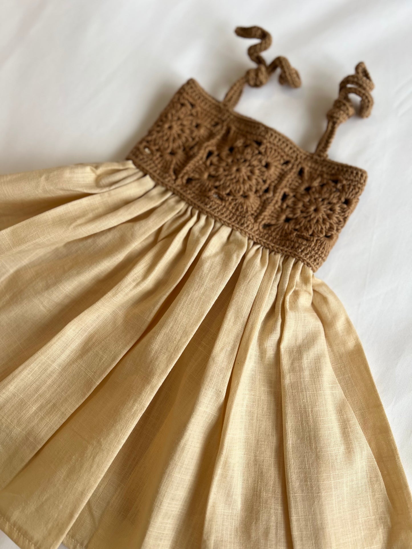 The crochet dress in tan