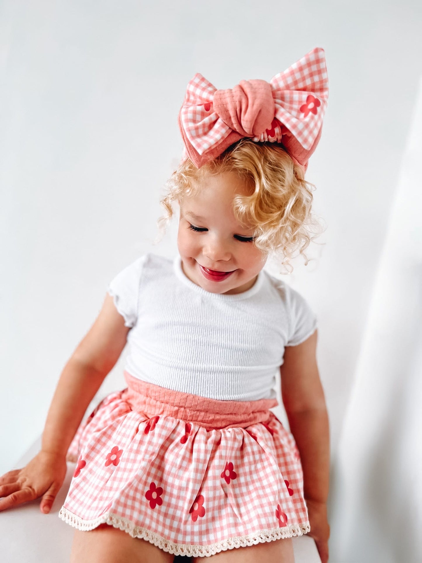 The Daisy peplum bloomers and chunky top knot-sold as a set