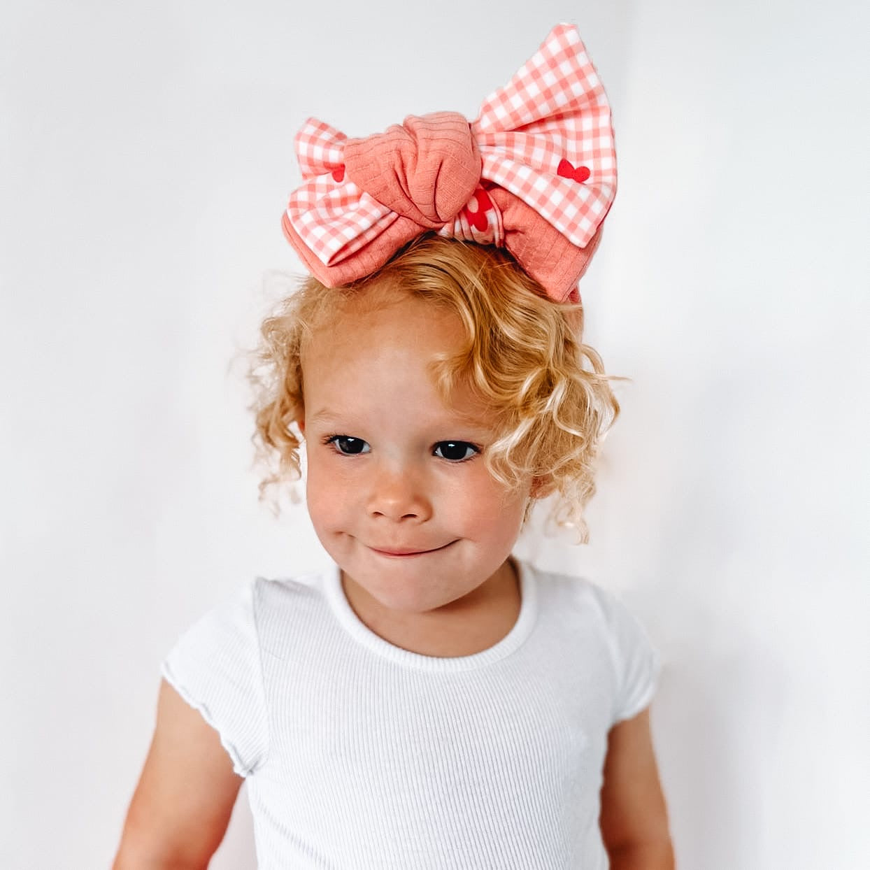 The Daisy peplum bloomers and chunky top knot-sold as a set