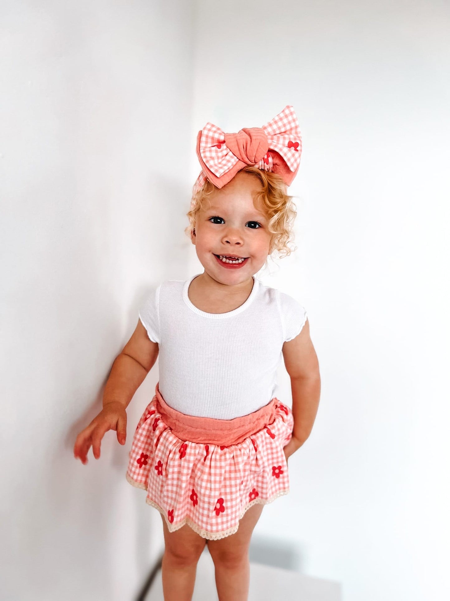 The Daisy peplum bloomers and chunky top knot-sold as a set