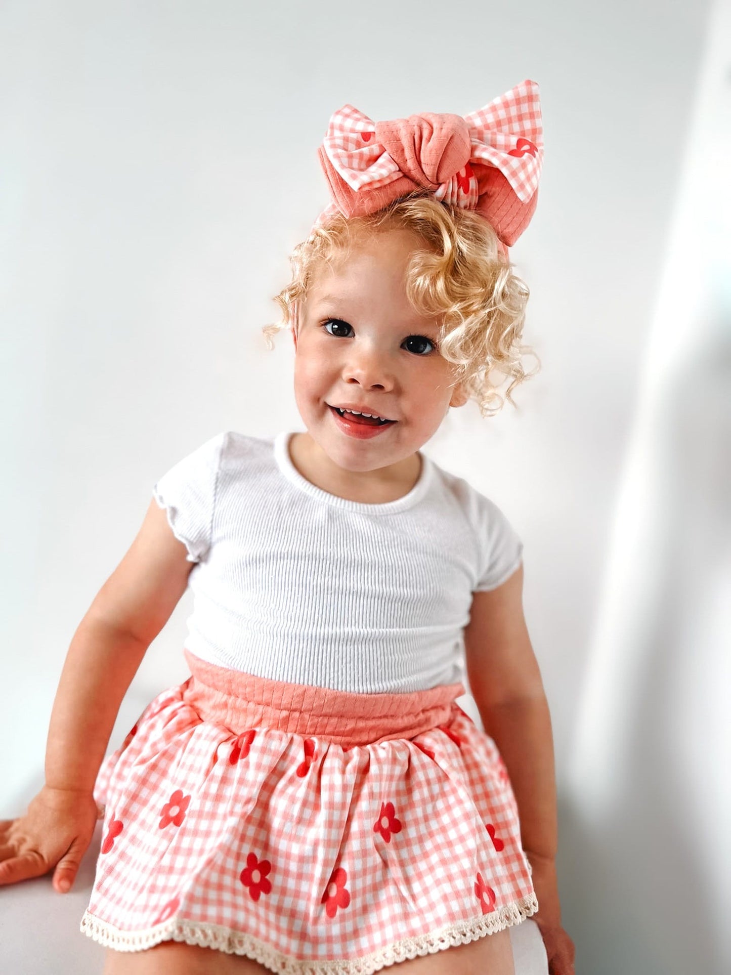 The Daisy peplum bloomers and chunky top knot-sold as a set