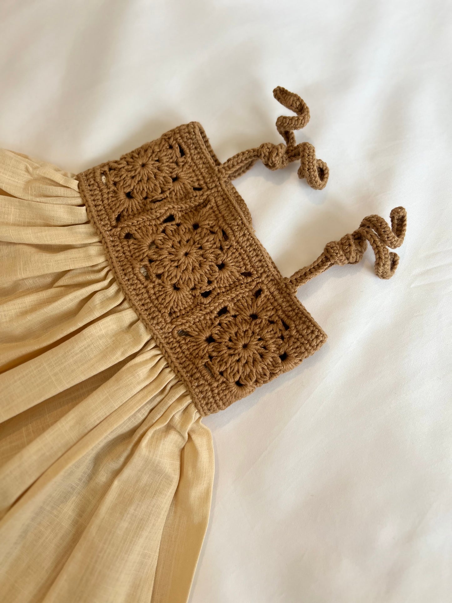 The crochet dress in tan
