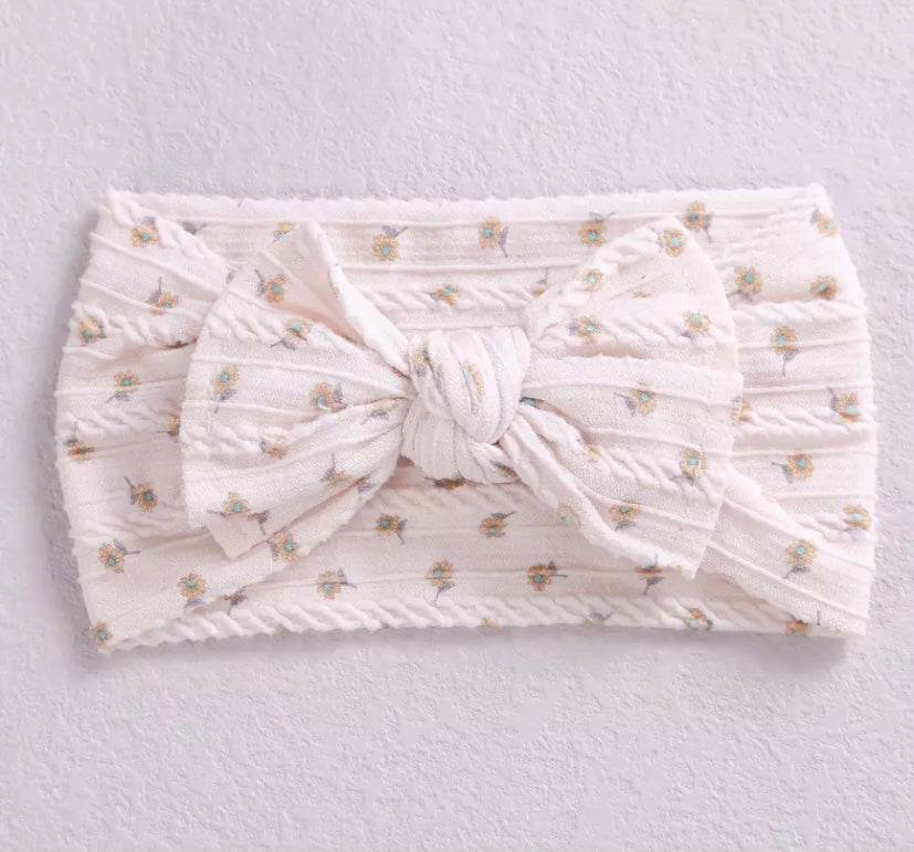 Floral cable knit bow headbands
