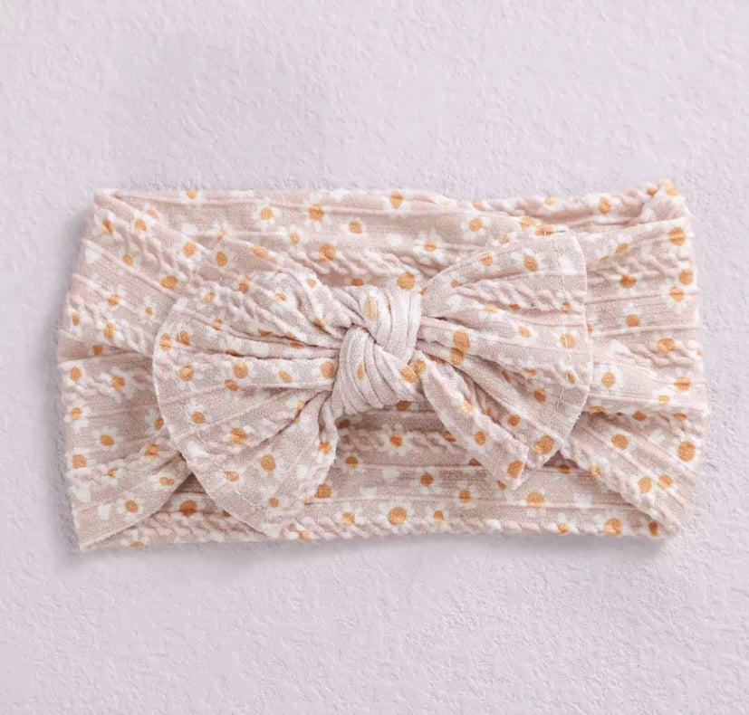 Floral cable knit bow headbands